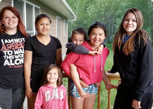 Smiling forever family on the porch